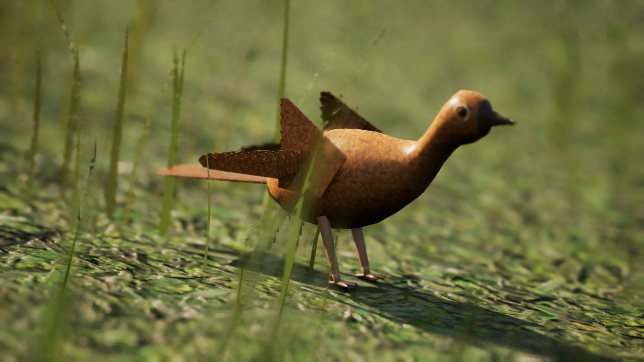 A small russet-brown wren standing side-on in grass.
