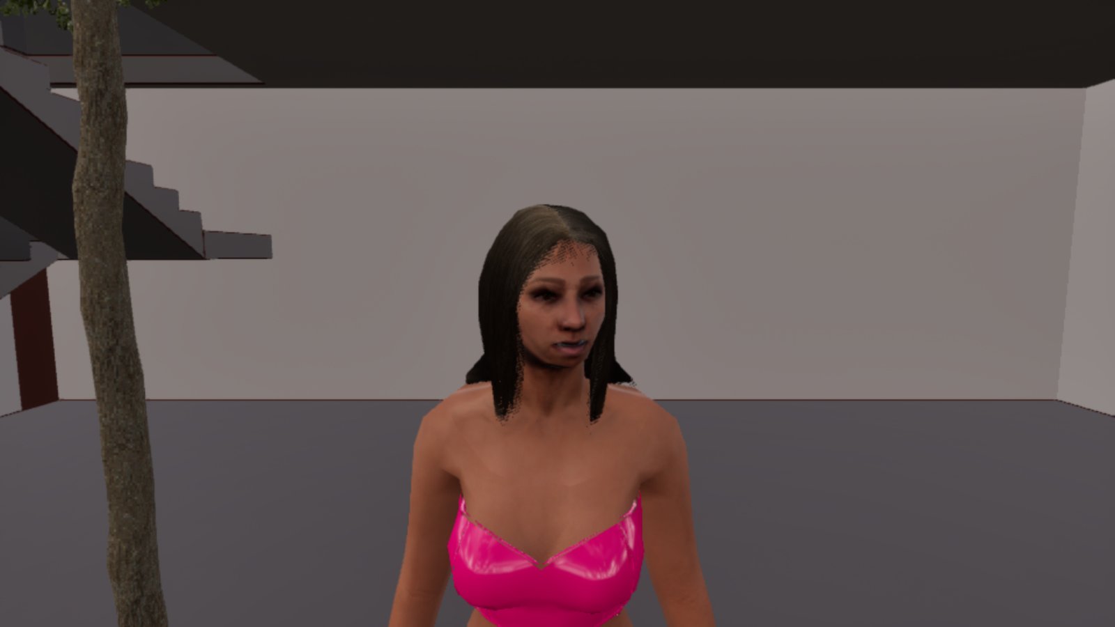 A woman with shoulder-length dark hair in a pink strapless top stands in a plain grey room with a staircase behind her, and the trunk of a street tree rises through the floor and ceiling just to her left.