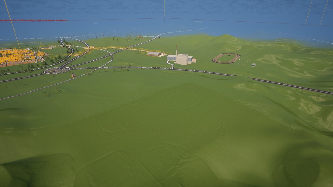 An aerial editor view across rolling green ground towards a town on the left, with white-lined roads, a roundabout, a large pale industrial building with a chimney and an oval racing track. The foreground is a broad smooth slope where hills have been levelled. Orange selection outlines cover the town and a red engine warning about video memory runs across the top.