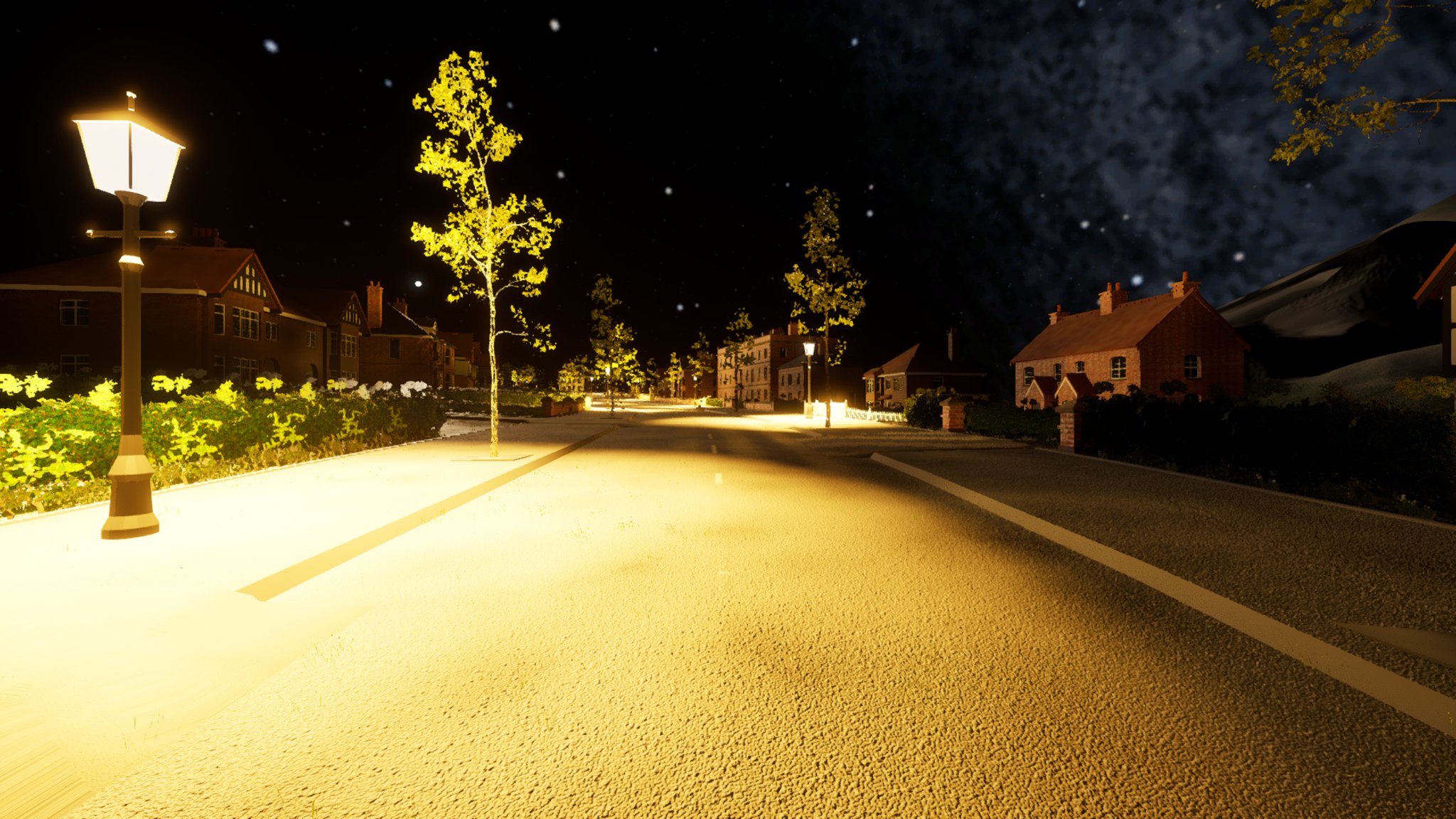 A wide avenue at night under a starry sky, a black Victorian-style gas lantern on the left verge glowing white. Warm light pools on the road and footway near the lamp and falls away to darker tarmac on the right, with lit trees and villas down the street.