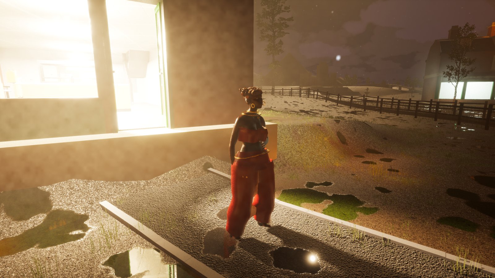 Night, outside the same lit shopfront from a different angle. The woman in red trousers now stands upright on the path by the window, with orange lamplight on the gravel and houses with lit windows behind a fence.