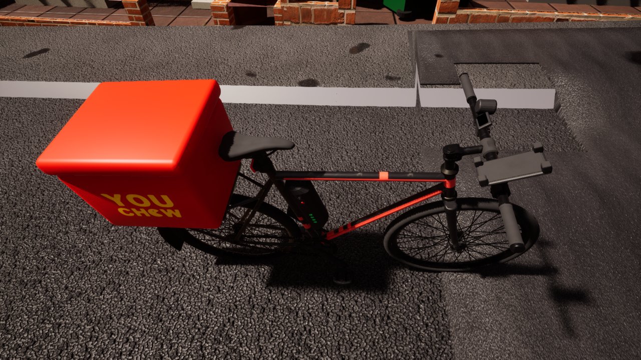 A black delivery e-bike at the kerb, seen from above: a red YOUCHEW box on the rear rack, a battery on the frame with its charge lights showing green, and a phone bracket on the handlebars.