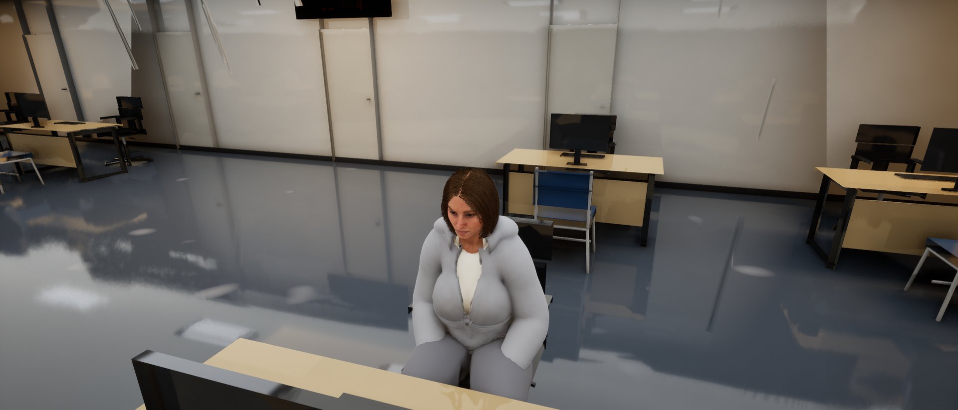 An adviser at a desk in a job centre under flat strip lighting, rows of empty desks behind.